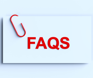 A card with a red paper clip with FAQS printed on it. 